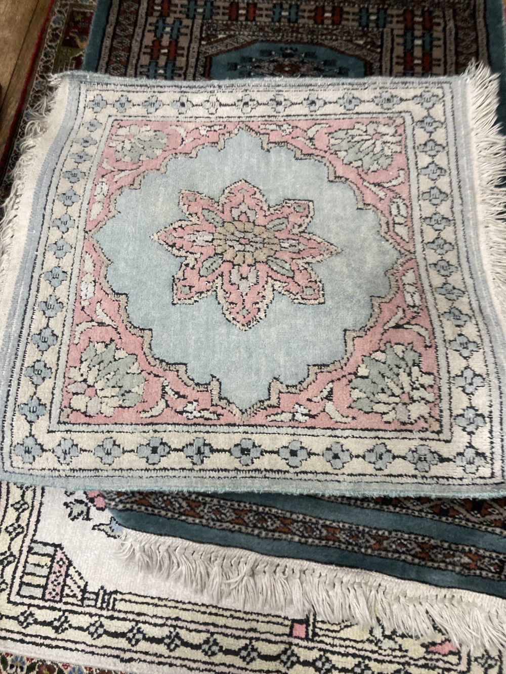 A Persian silk prayer rug and six other Eastern mats, largest 80 x 60cm (7)